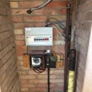 This 1990s fuseboard in Bickley Bromley lives in a small cupboard - Before